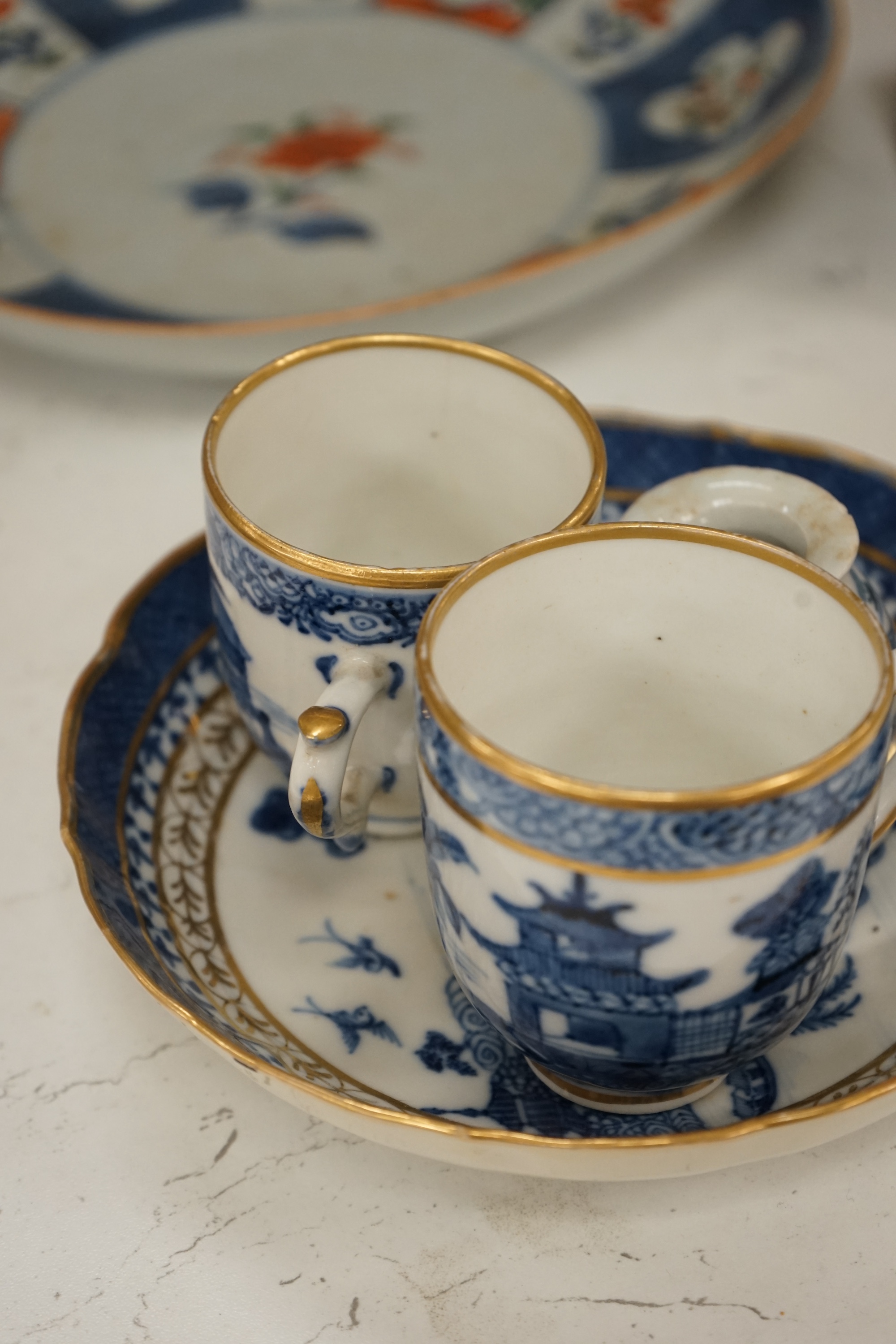 An 18th century Chinese export Imari pattern dish together with other Chinese blue and white ceramics, a hardwood stand and a bone calligraphy brush. Condition - varies